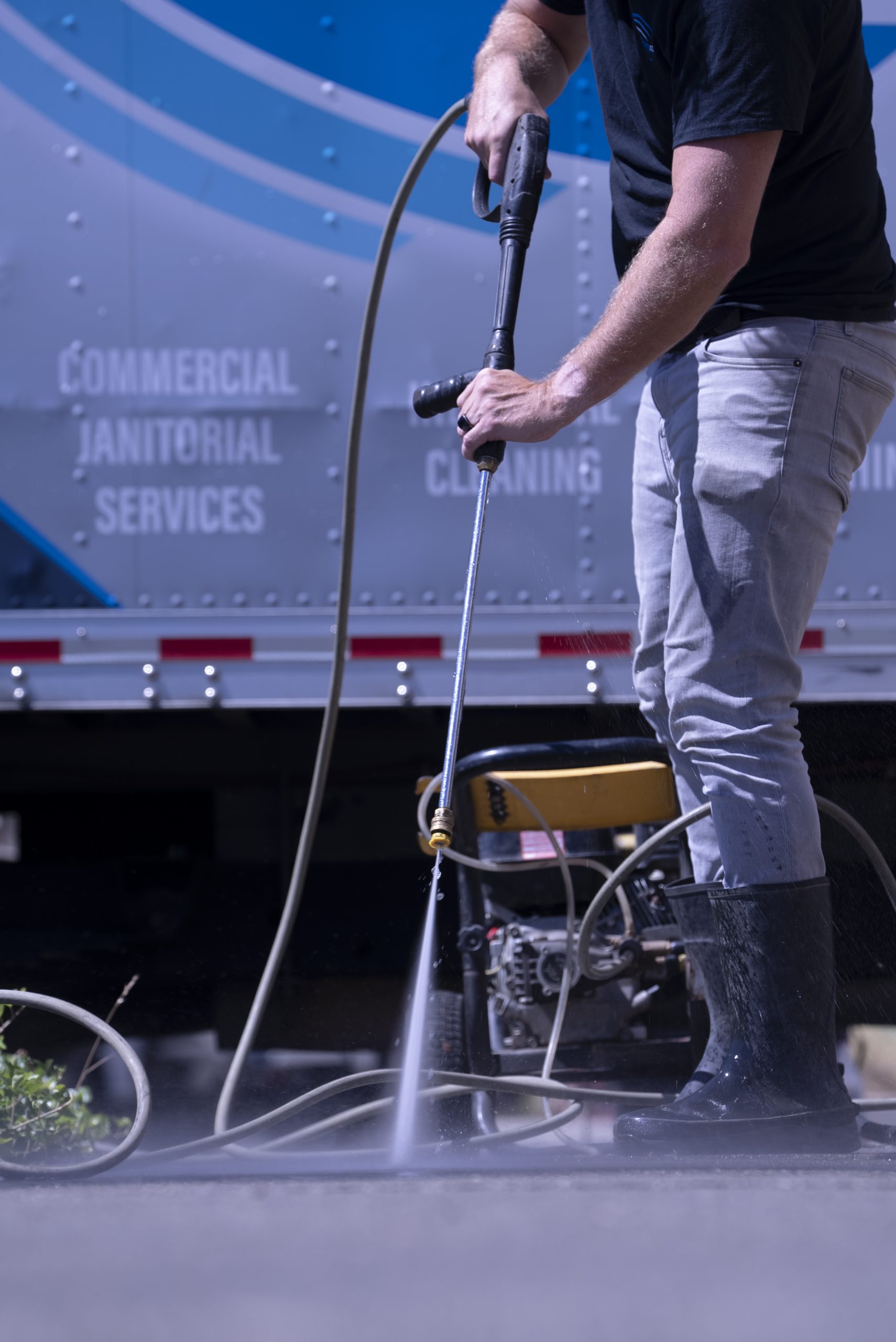 Cleanstart technician power washing a commercial vehicle Cleanstart technician power washing a commercial vehicle