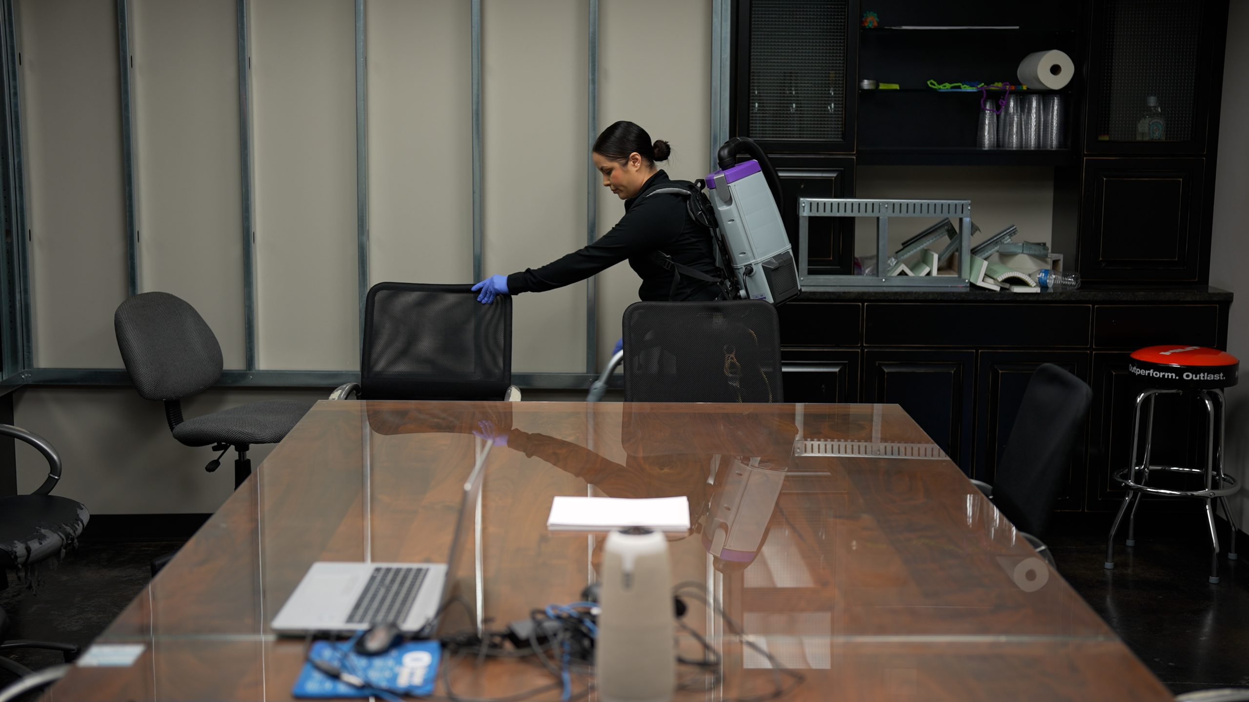 law office cleaning services - cleaning and vacuuming conference room 